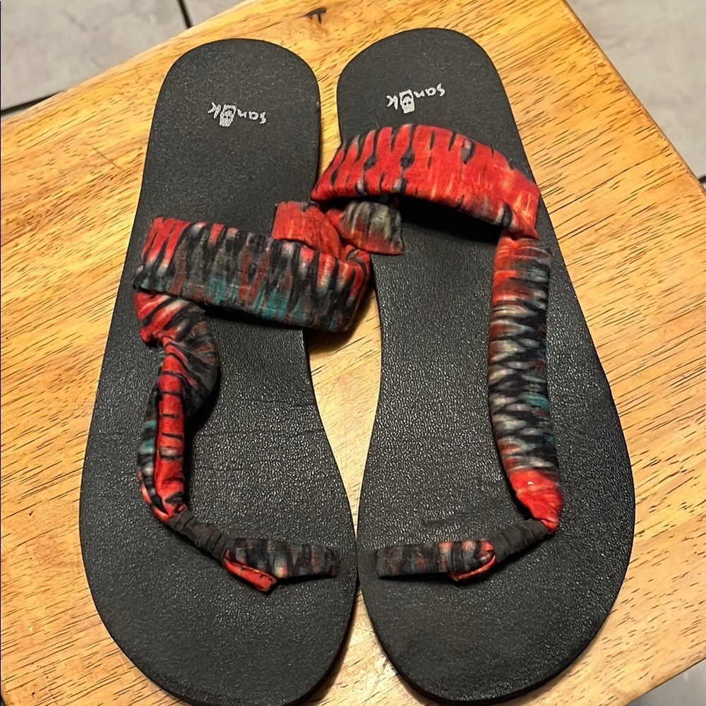 Sanuk Black and Red Sandals with Intricate Woven Straps